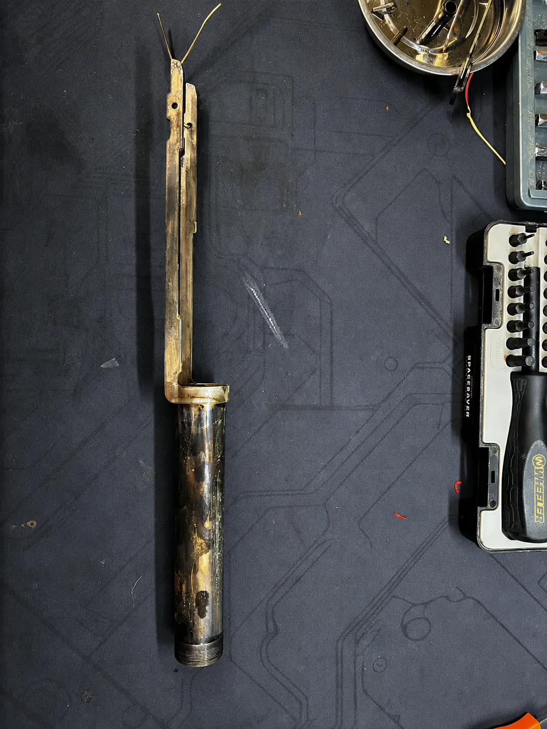 Fully disassembled firearm action after stripping and before abrasive blasting